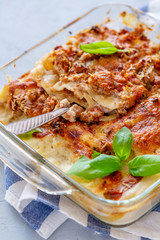 Cannelloni with minced meat and cream sauce.