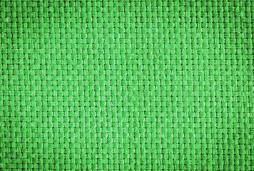 Green fabric texture photo for graphic design and backgrounds.  Shaded and rustic.