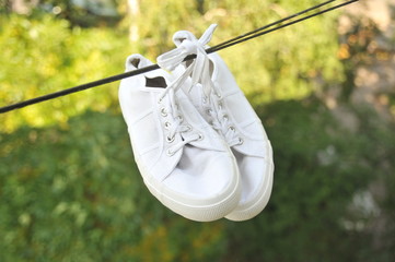 white sneakers in a rope