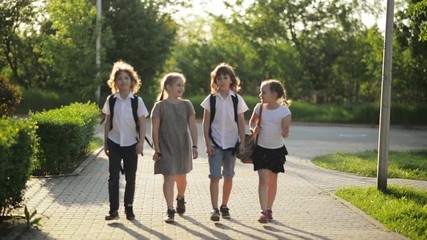 Group of Smiling Students Are Talking To Each Other During The School Break.