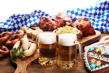 Traditional German cuisine, Schweinshaxe roasted ham hock. Beer, pretzels and various Bavarian specialties. Oktoberfest background