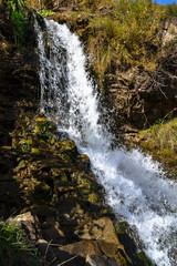 waterfall in the forest on a Sunny day