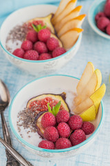 Smoothie bowl with fresh fruits, chia seeds, raspberry and fig