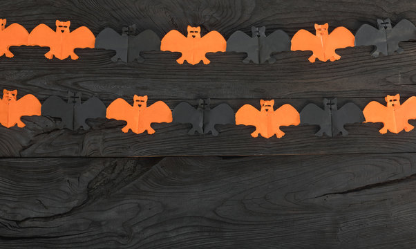 concept of a Halloween holiday on a black wooden background