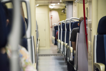 Fototapeta na wymiar Red blue comfortable seats on the train,