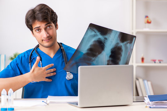 Male doctor radiologist with x-ray can image
