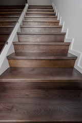 Closeup photo of modern brown oak wooden stairs