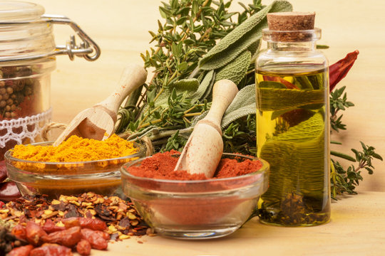 Various spices on wooden background.