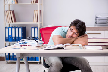 Young handsome student preparing for school exams