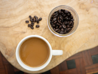 Coffee and Beans on Wooden Background