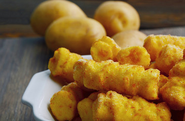 Frozen Cylindrical potato croquettes or German name is Kroketten.
Food Product from Potatoes.