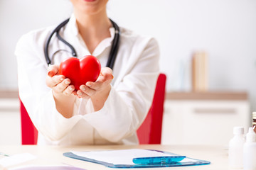 Young doctor in heart care concept