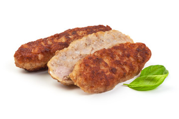 Fried long pork cutlets with basil leaves, isolated on white background.