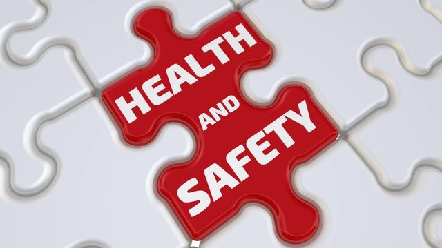Health and safety. The inscription on the missing element of the puzzle. Folding white puzzles elements and one red with text HEALTH AND SAFETY. Footage video