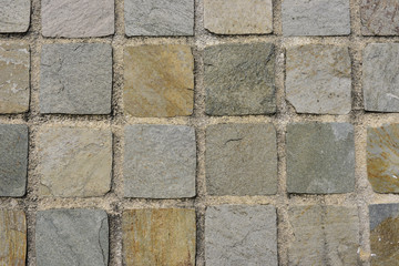 Mur en mosaïque de pierres carrées