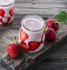 smoothies of fresh strawberries and yogurt in a glass jar
