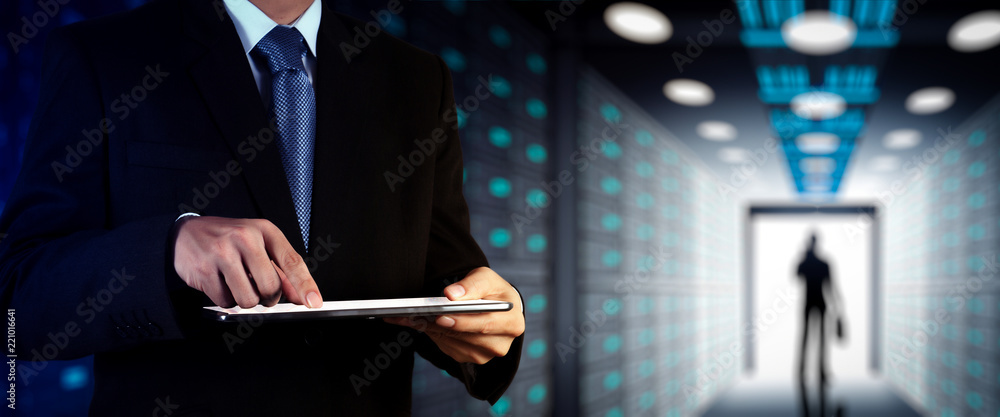 Poster Businessman working with VR wide blank screen computer on server room in background.