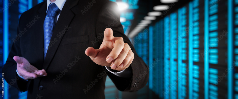 Poster Businessman working with VR wide blank screen computer on server room in background.