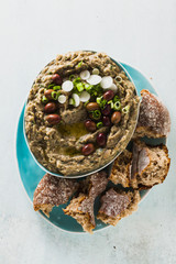 Appetizer with baba ganush of eggplant, olives from kalamata, green onions and fresh rye bread. Mediterranean snack. Vegan healthy food
