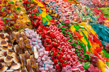 Assorted gummy candies in the shop. Jelly sweets in different shapes and colors