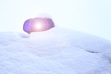 it's snowing outside. police car all in the snow. only flashing lights are visible © sir270
