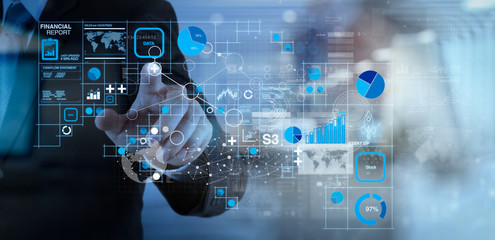 Fototapeta premium businessman hand working with modern technology and digital layer effect as business strategy concept