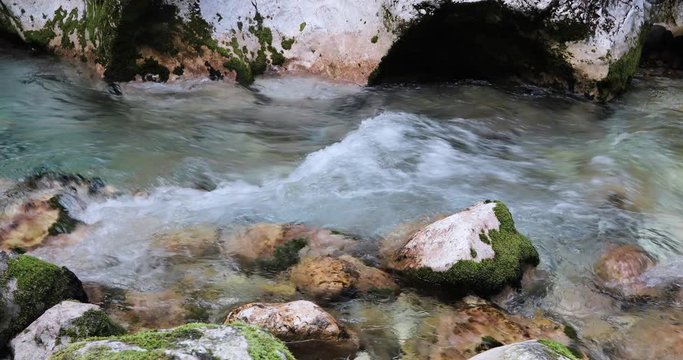 Mountain river details in slow motion. Dolly slider equipment used.