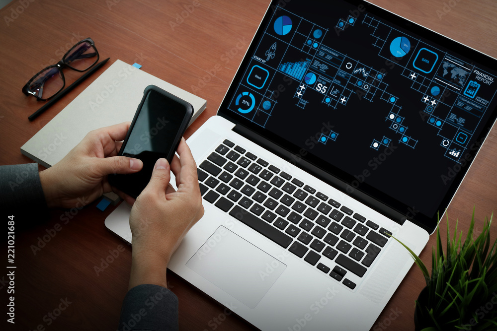Aufkleber top view of businessman hand using on smart phone and laptop computer as concept