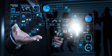 Businessman hand working with a digital tablet on meeting room background