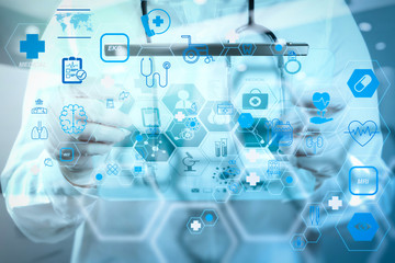 Doctor working at workspace with laptop computer in medical workspace office