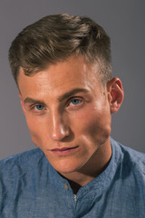 Obraz premium Handsome man posing in the studio for clothes shooting