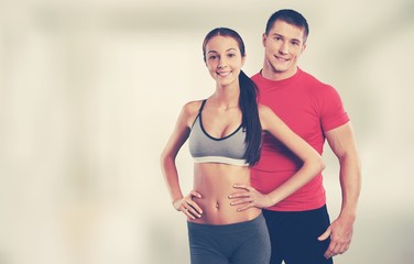 Young sporty couple in gym