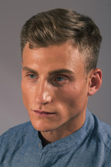 Fototapeta premium Handsome man posing in the studio for clothes shooting