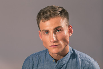 Obraz premium Handsome man posing in the studio for clothes shooting