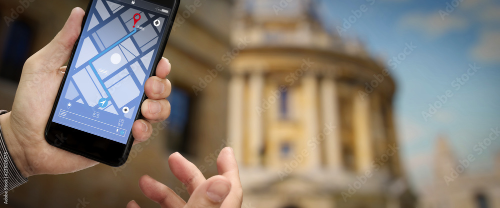 Poster Close up of Tourist using GPS map navigation on smartphone application screen for direction to destination address in the city with travel and technology concept.