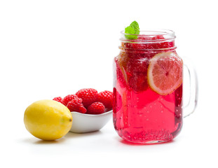 Homemade  lemonade with raspberry and lemon isolated on white