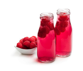 Homemade  lemonade with raspberry isolated on white