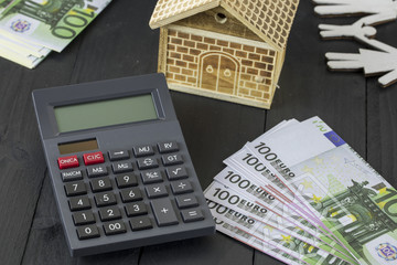 Real estate and Mortgage Concept. Money , House  and Calculator.
