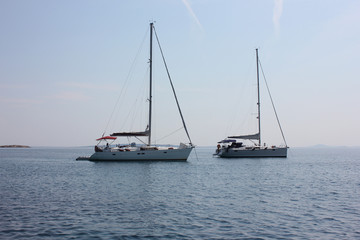 Sail boat on blue water