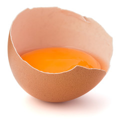 Broken egg  in eggshell half isolated on white background cutout