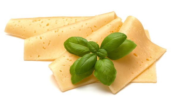 cheese slices and basil herb leaves isolated on white background cutout