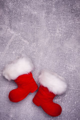 Christmas greeting card. Noel festive background. New year symbol. Santas shoes.