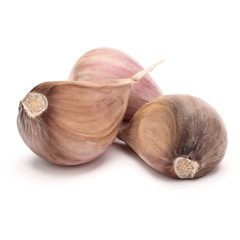 Three garlic cloves isolated on white background cutout
