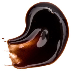 Chocolate syrup drop isolated on white background. Top view. .