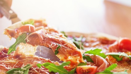 Fototapeta na wymiar Closeup of a Pizza with Ham