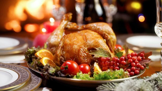 Closeup 4k footage of served table with roasted chicken and vegetables for Christmas dinner