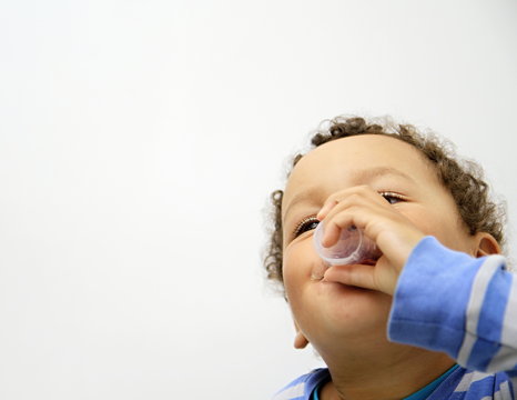 Young Boy Taking Medicine