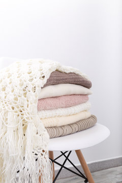 Stack of cozy knitted sweaters
