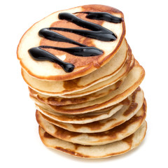 Pancakes  stack with chocolate syrup on white background