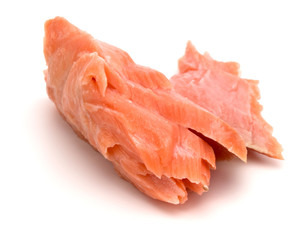 smoked salmon segments isolated on white background cutout. Prepared fish fillet fibres.